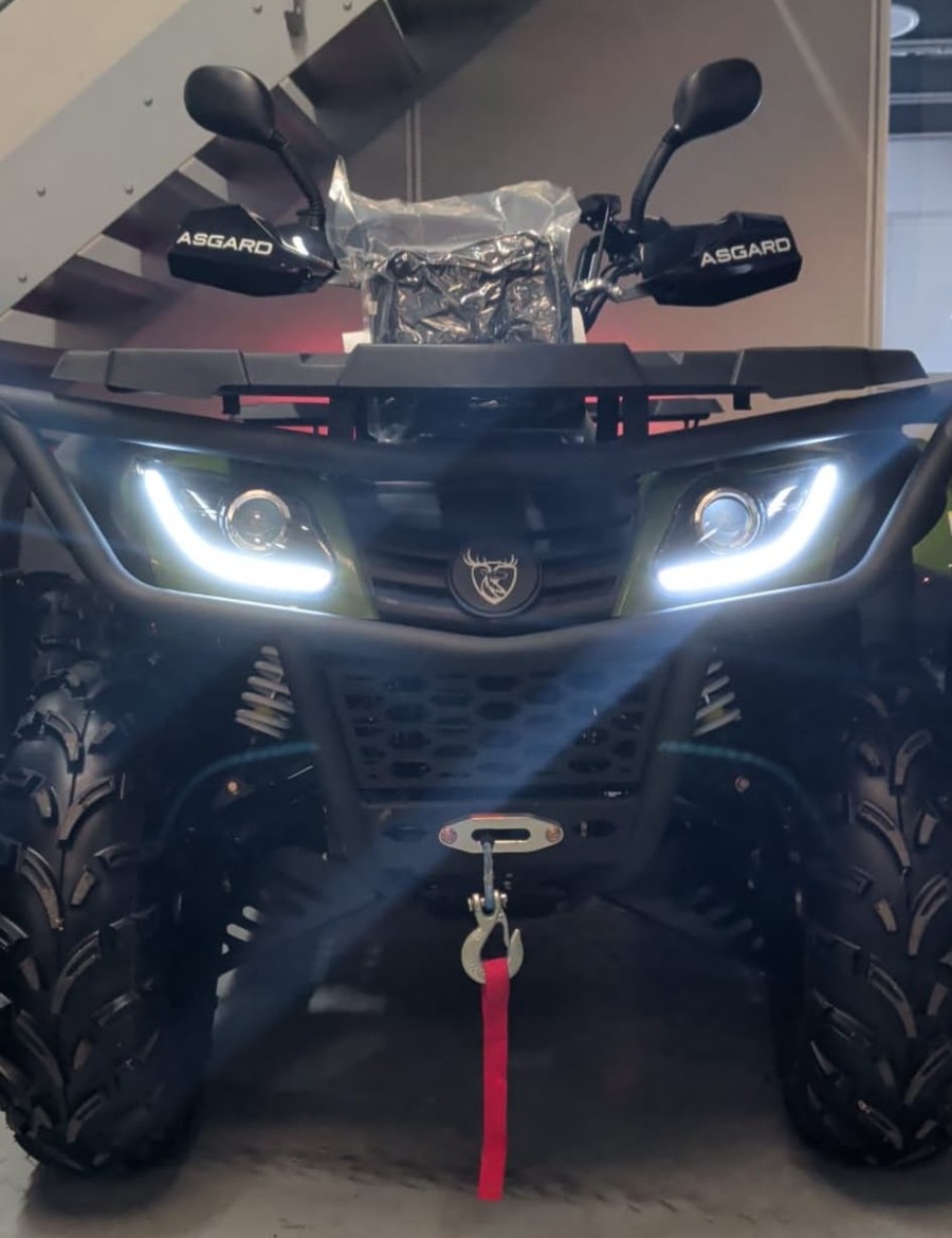 Front view of the Asgard Éclaireur electric quad, showing its headlights, protective frame and winch